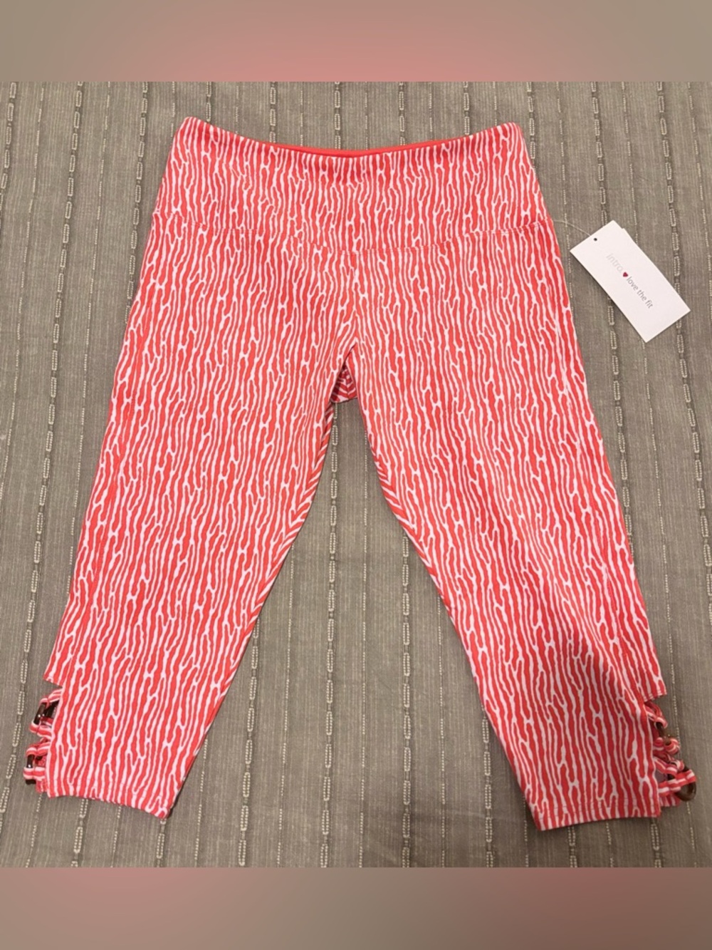 NWT intro. Coral and White Patterned Capri Leggings